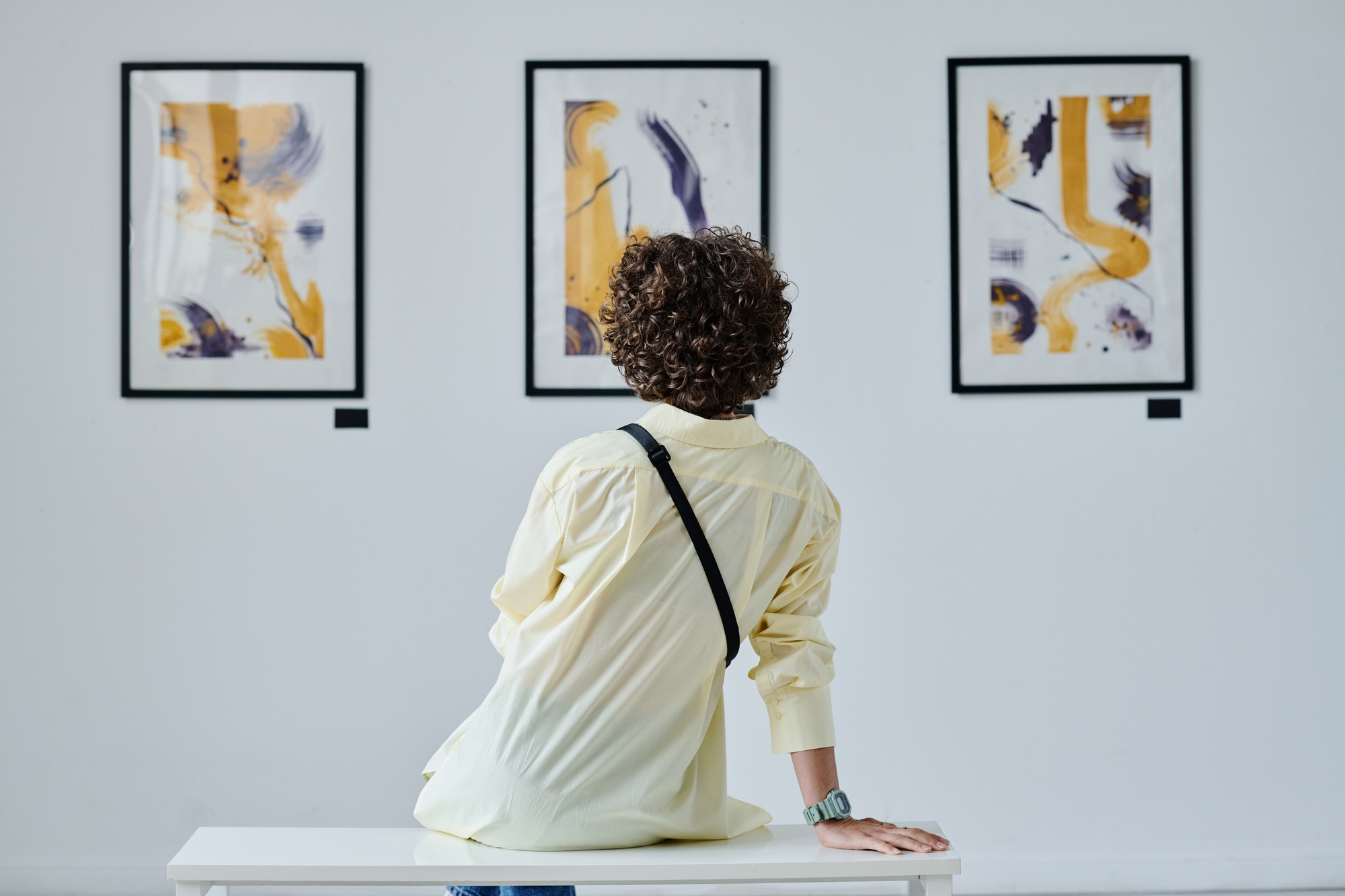 Woman enjoying the art at gallery